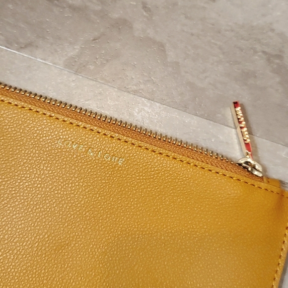NWOT Love & Lore small thin zip pouch. Vegan leather (faux). Tan/mustard yellow. - Picture 3 of 7